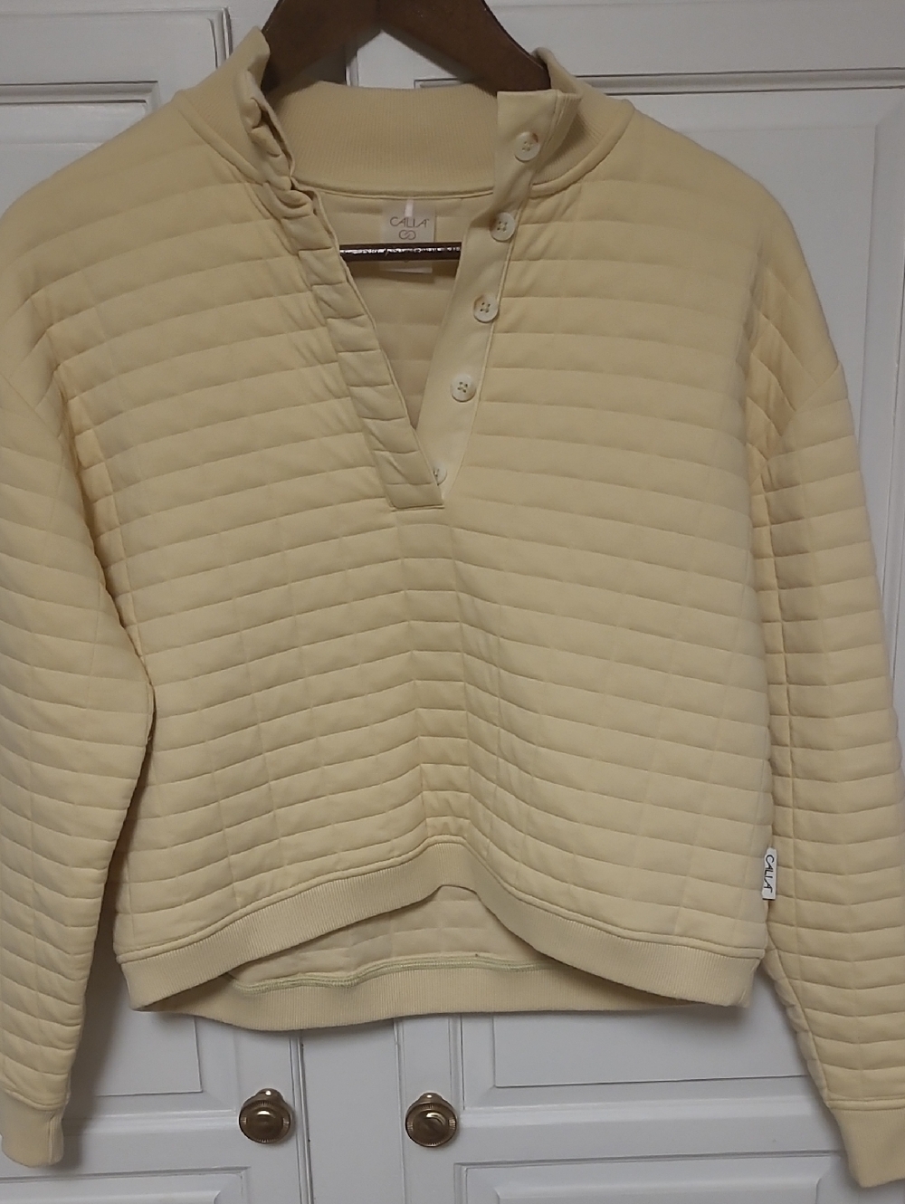 Calia Cropped Quilted Button-Neck Pullover in Soft Pale Yellow